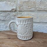 Old terracotta mug with glazed interior