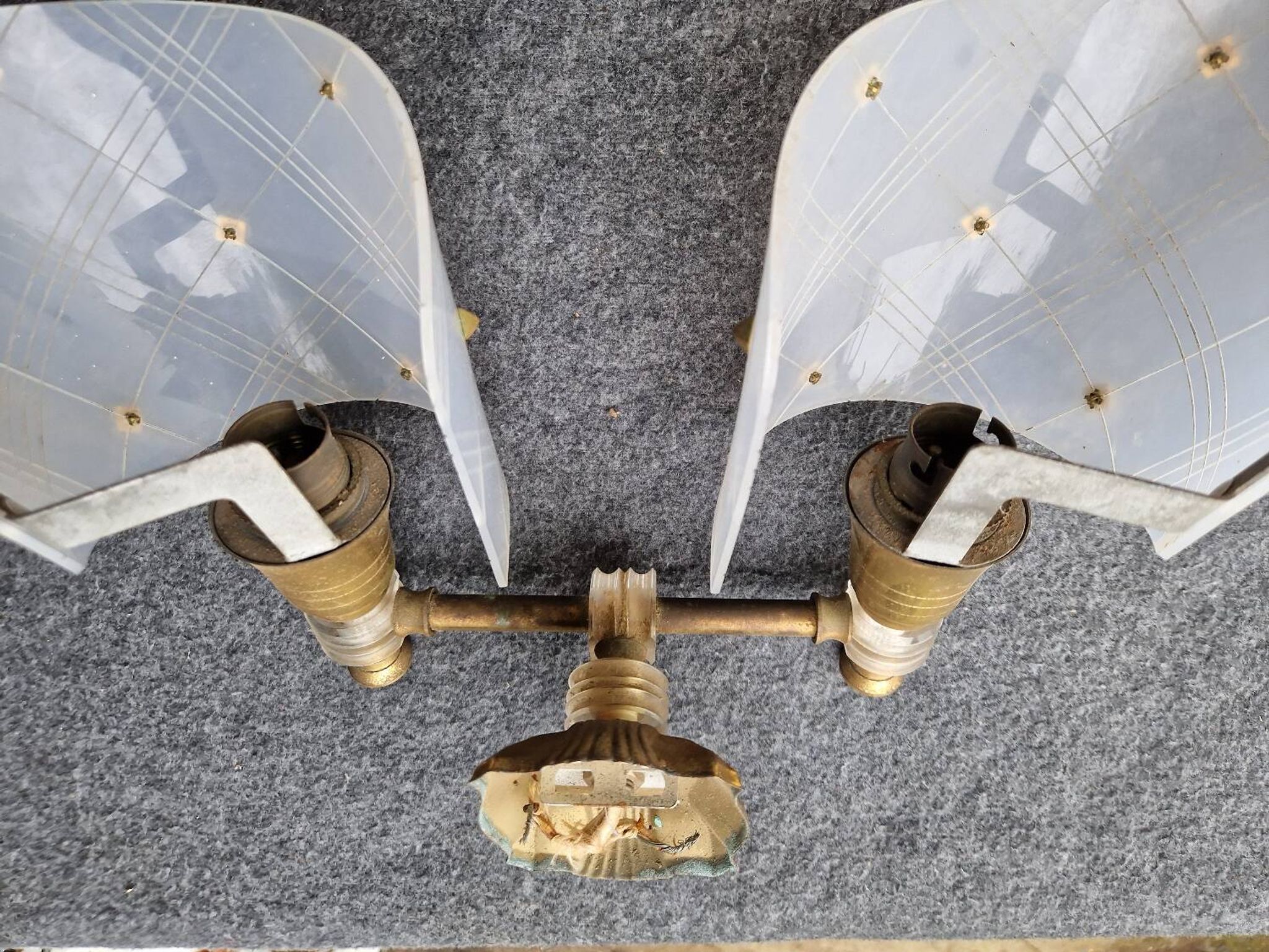 Pair of plastic and brass wall lights from the 60s/70s.