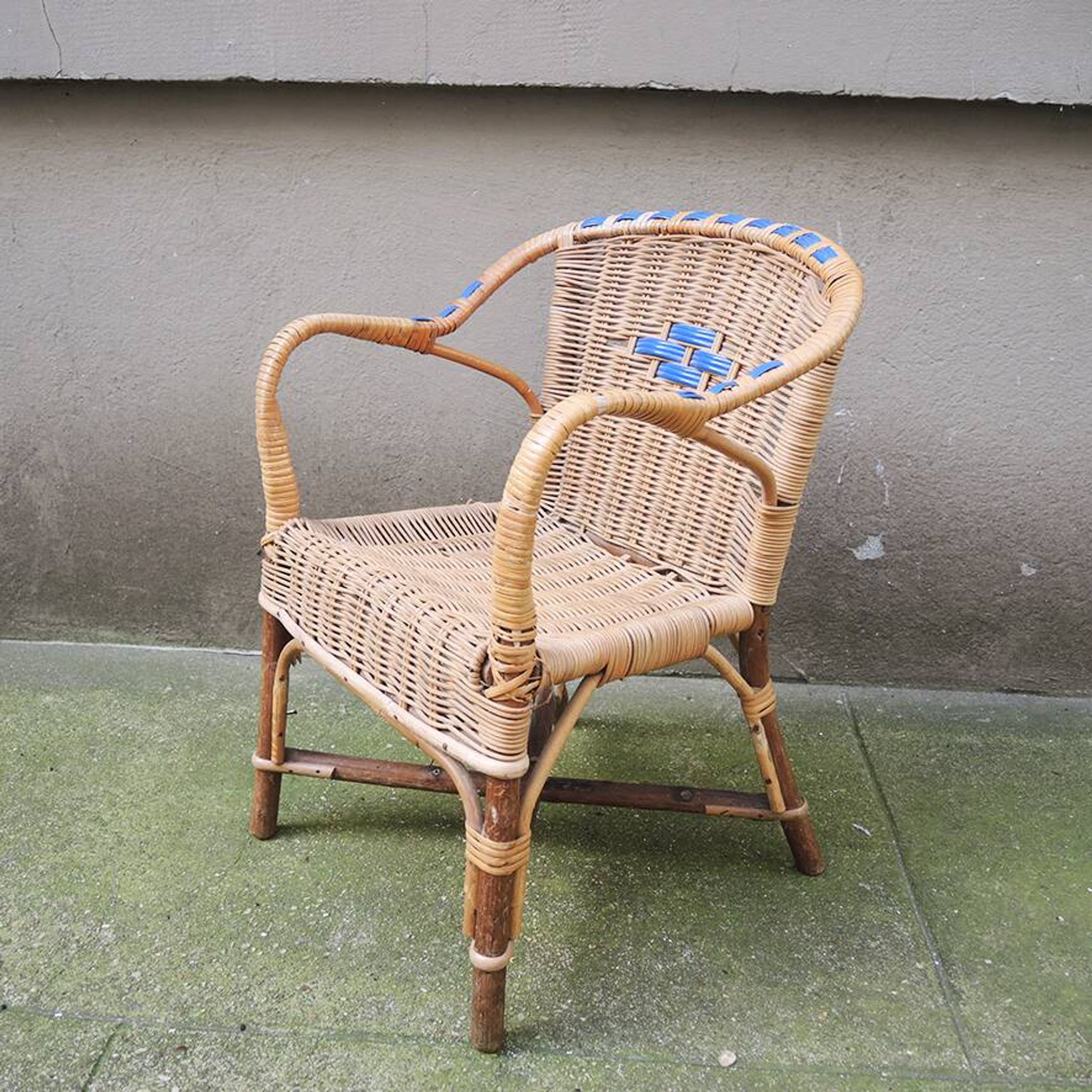 Old wicker chair for children