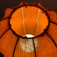 Lamp with a plastic base and a coloured fabric shade in Mid Century style.