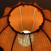 Lamp with a plastic base and a coloured fabric shade in Mid Century style.