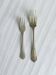 Pair of metal forks, ornate design