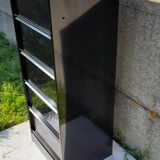Black metal clamshell cabinet