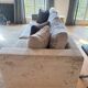 3-seater PMP Classy sofa in grey fabric and its 4 PMP cushions.