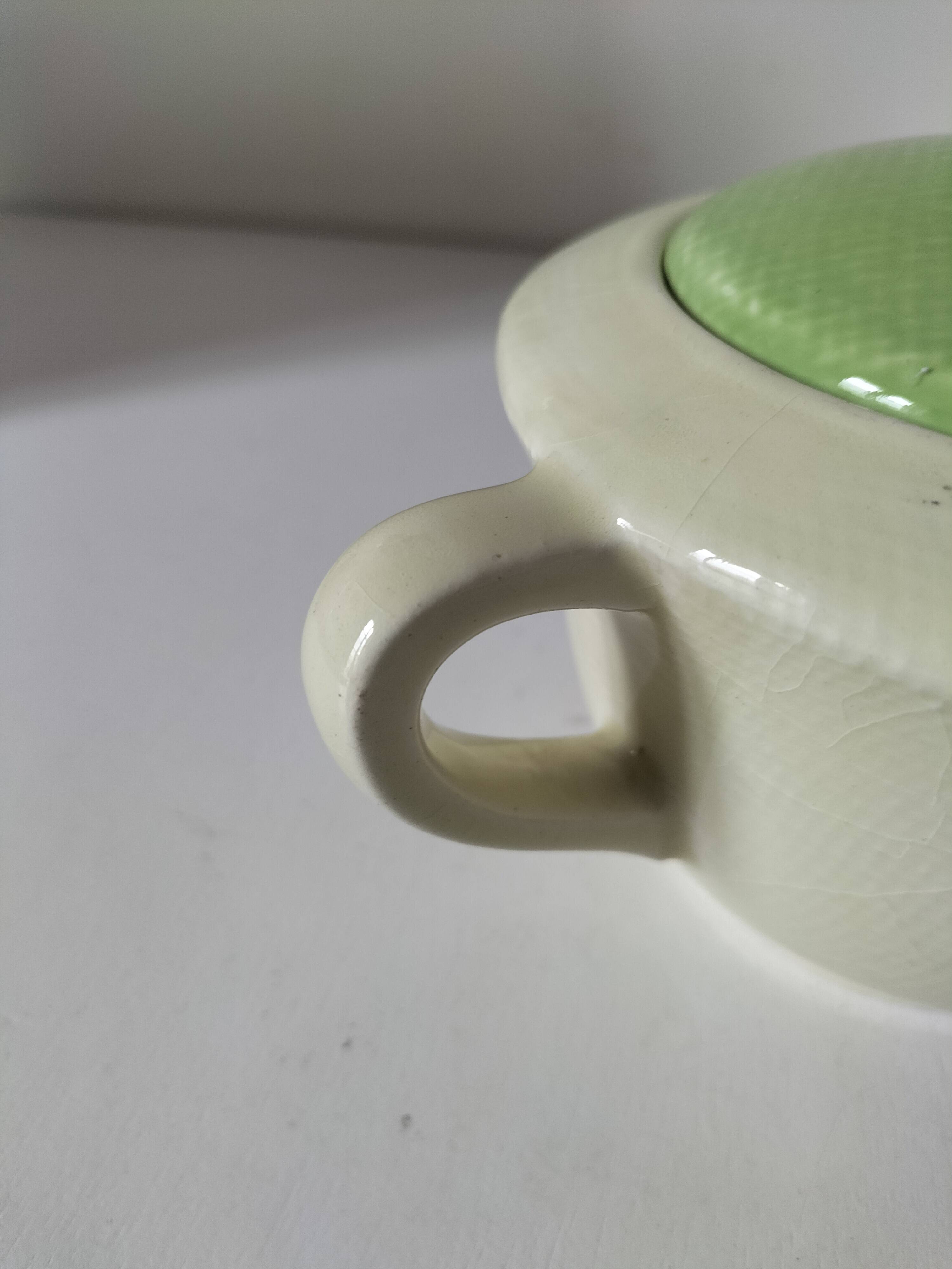 Two sugar bowls and a textured plate in turquoise and green Salins earthenware.