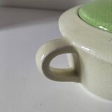 Two sugar bowls and a textured plate in turquoise and green Salins earthenware.