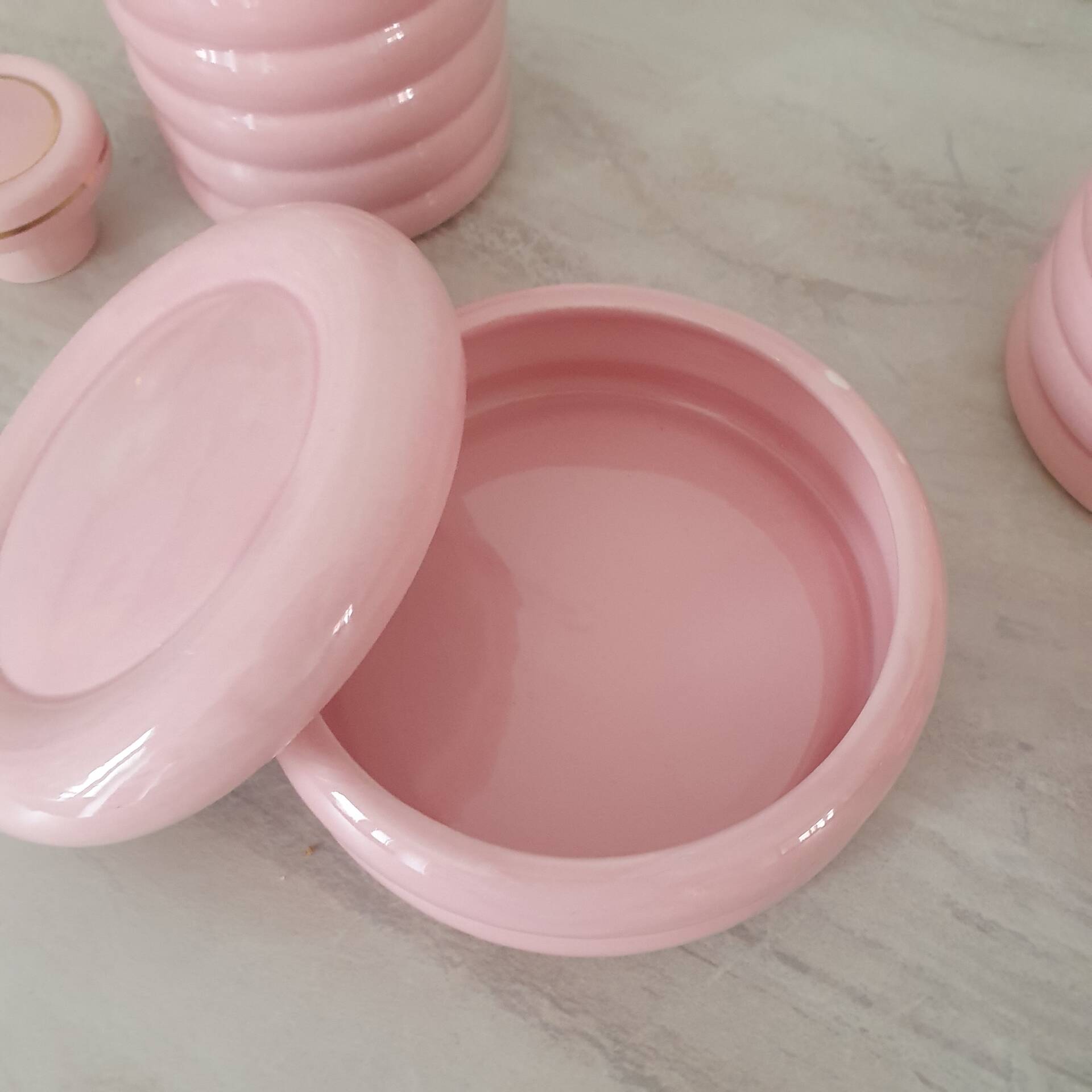 Set of pink and gold ceramic bathroom accessories
