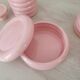 Set of pink and gold ceramic bathroom accessories