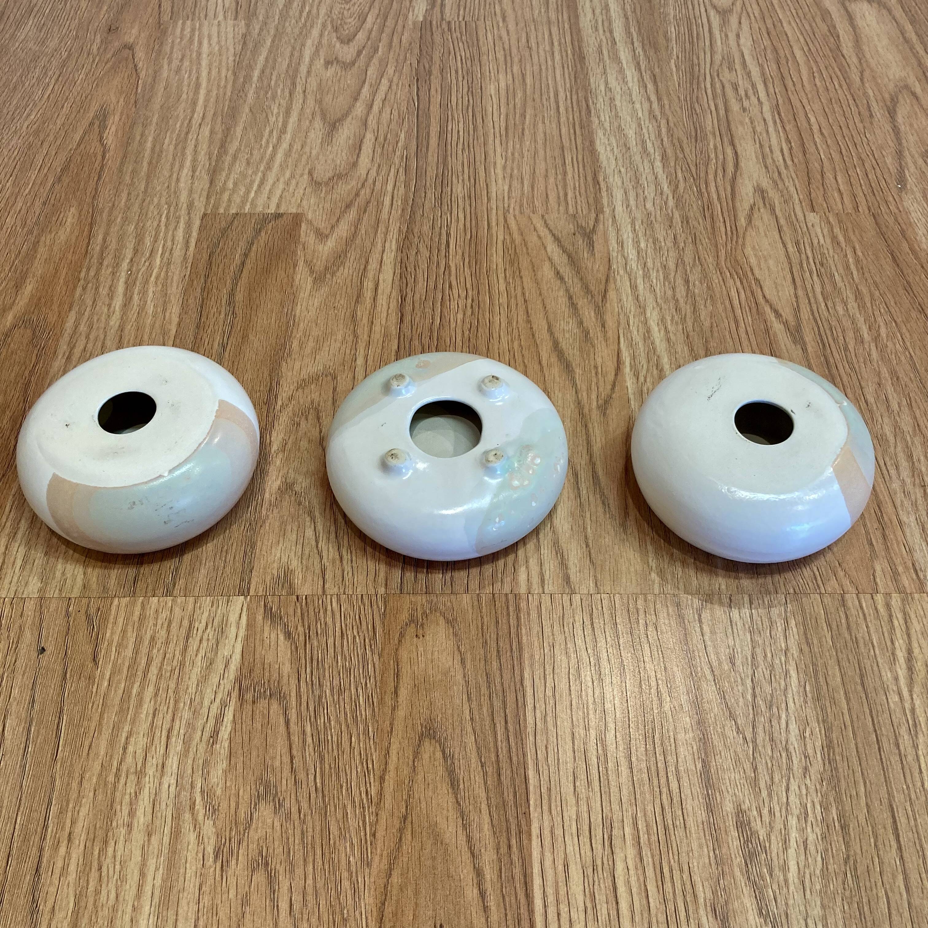 Handmade trio of candle holders.