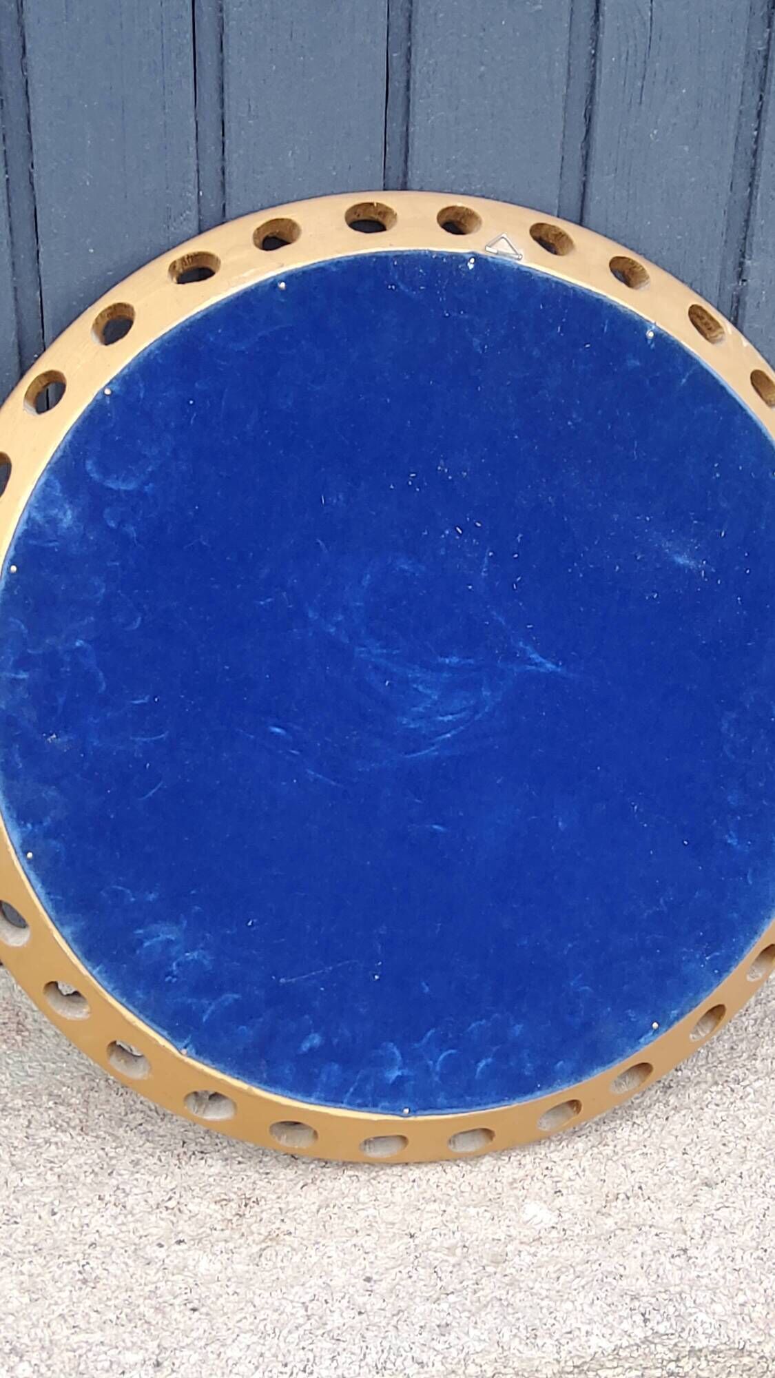 Round neoclassical style mirror in wood and gilded stucco from the 1950s
