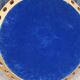 Round neoclassical style mirror in wood and gilded stucco from the 1950s