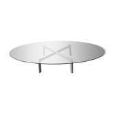 Table basse design en verre biseauté et pied acier
