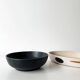 Round vintage black ceramic catchall.