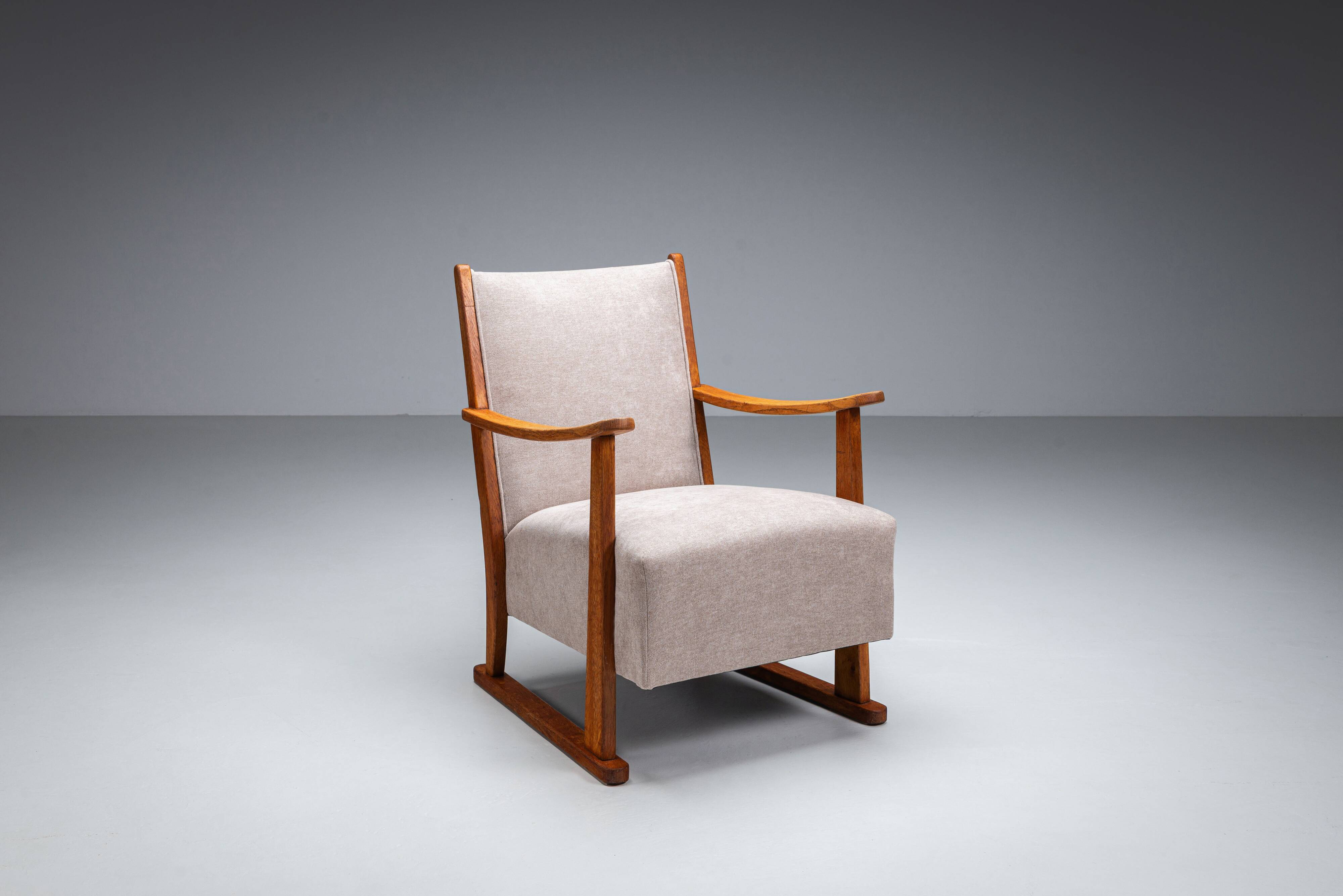 Oak armchair with curved armrests