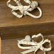 Metal and wood bow and ribbon hooks