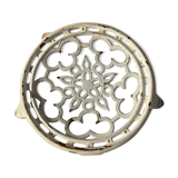 Old trivet in enameled cast iron round format white vintage tableware