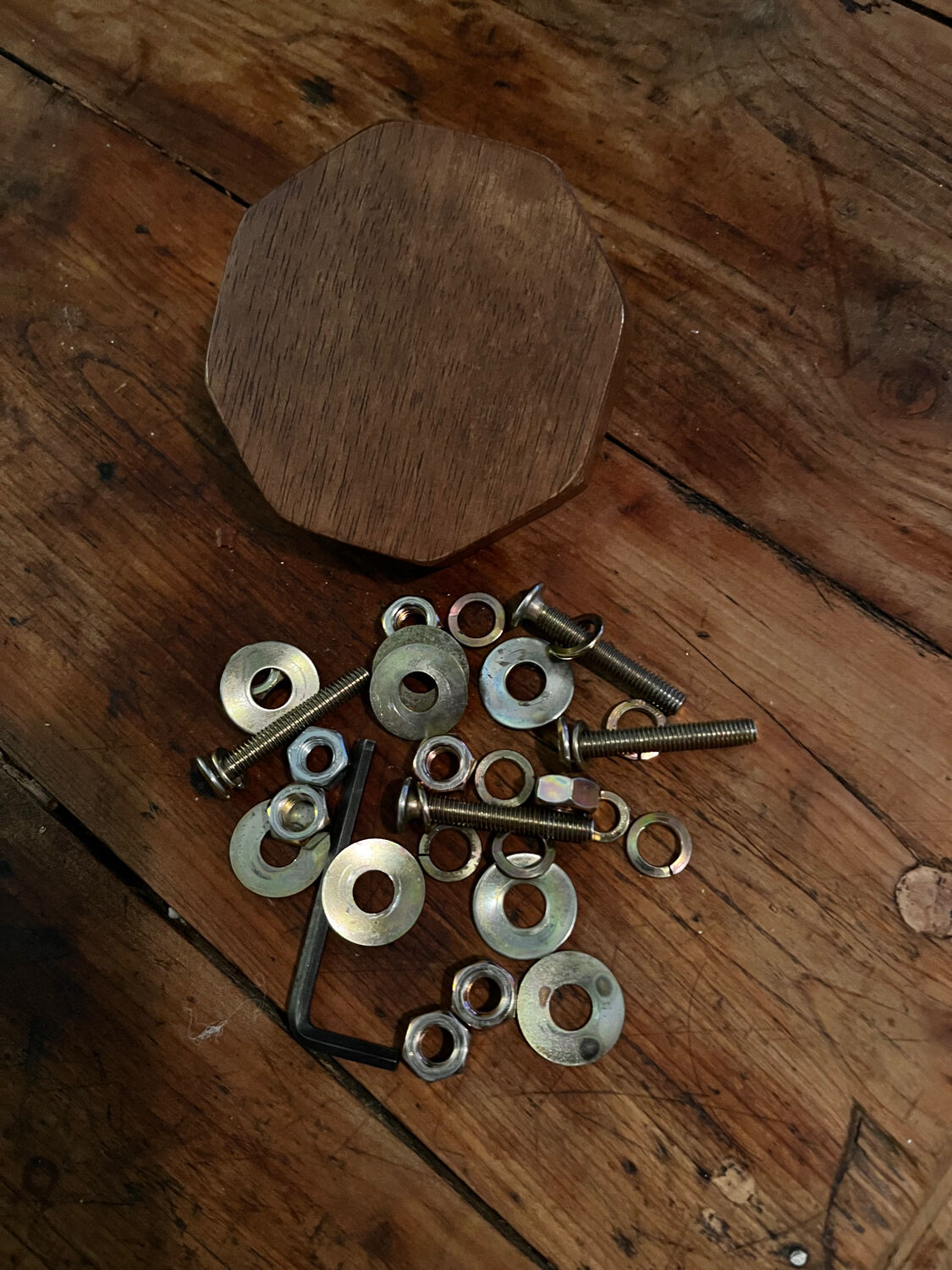 Round table made of solid wood with a walnut finish top.