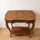 Louis XV console table with marquetry and bronze fittings.