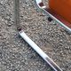 Pair of designer armchairs in orange fabrics and chrome tubes from the 70s