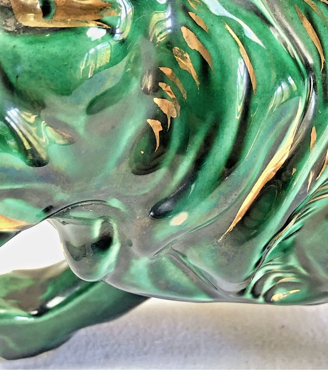 Art Deco lion statue cracked St Clement