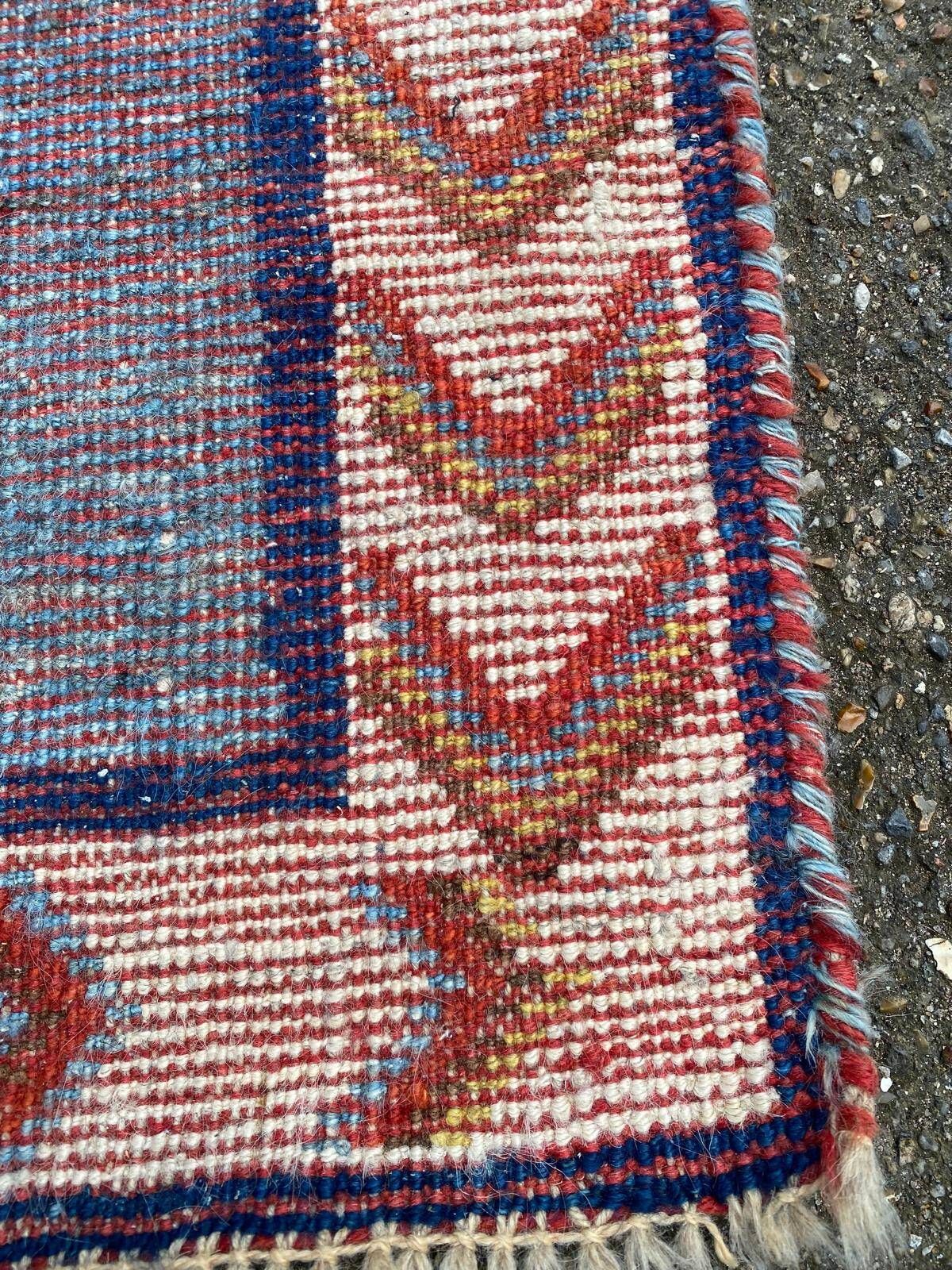 Handmade wool Berber rug with long pile, 110x150cm.