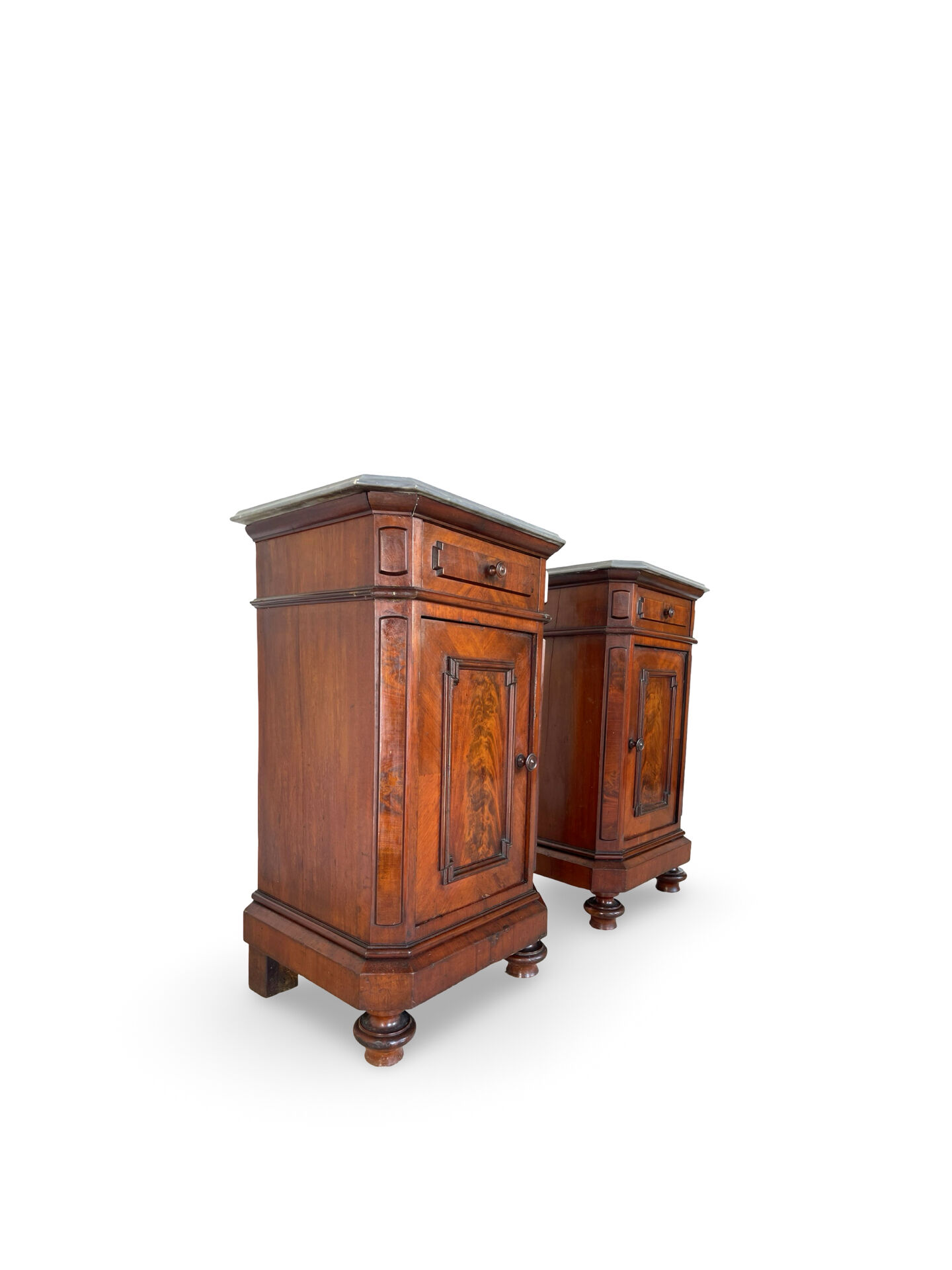 A pair of antique walnut bedside tables from the 1890s.