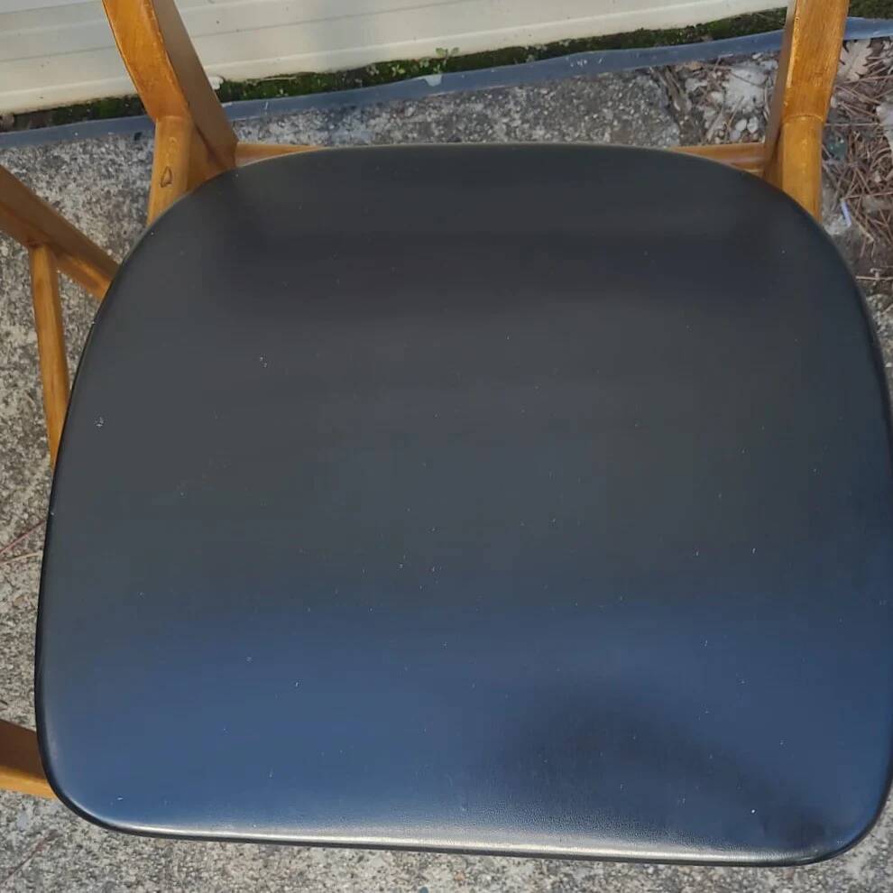 Set of 2 vintage Scandinavian chairs in teak and black faux leather by Kofod-Larsen, Denmark, 1960s.