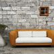Canapé vintage en rotin design 1970 tissu bouclette écru