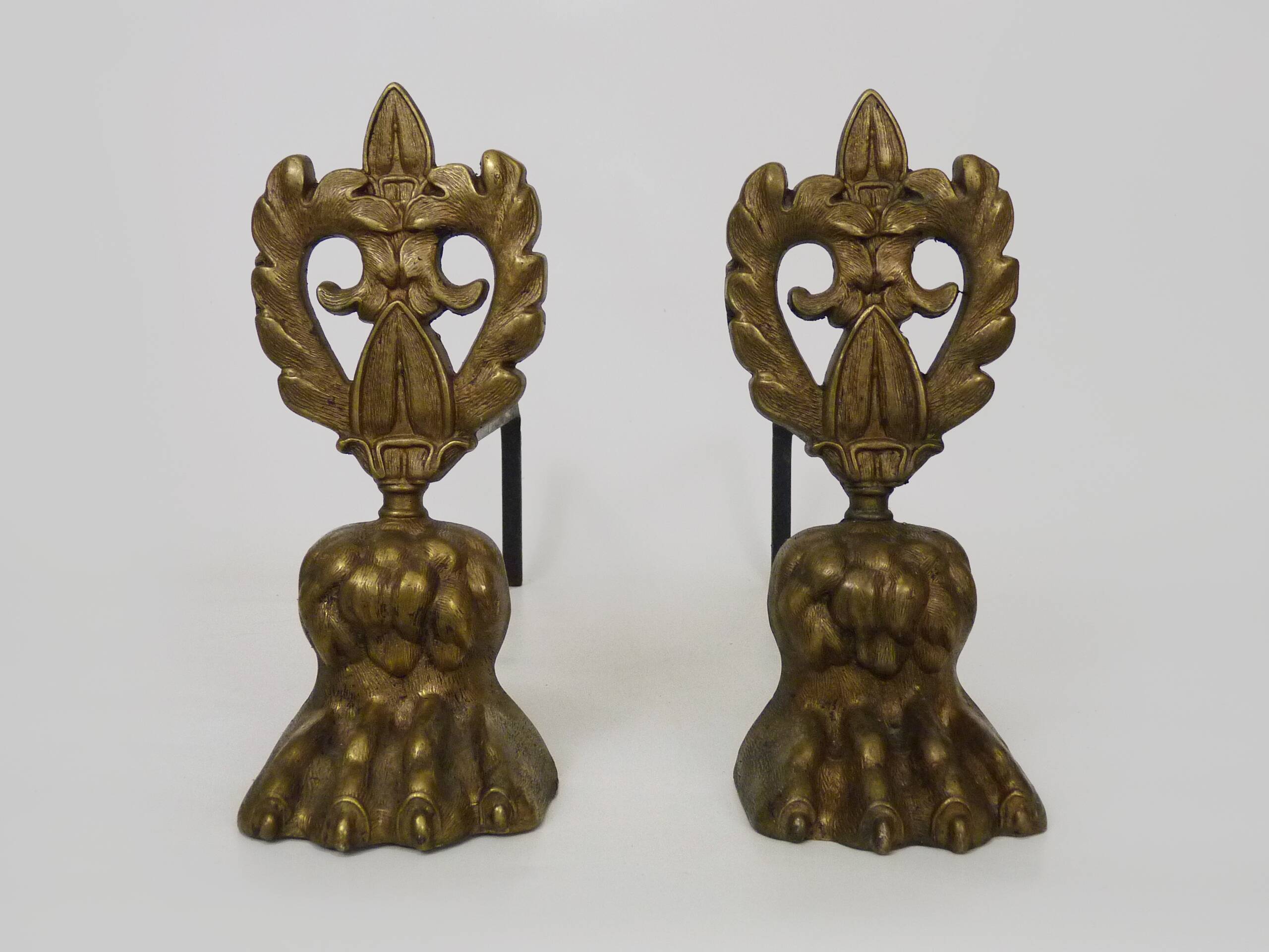 Pair of bronze fire dogs with lion paws. Early 20th century.