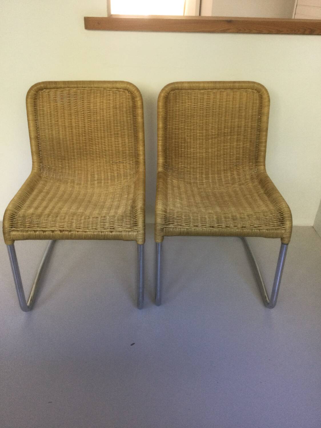 Pair of vintage rattan cantilever chairs