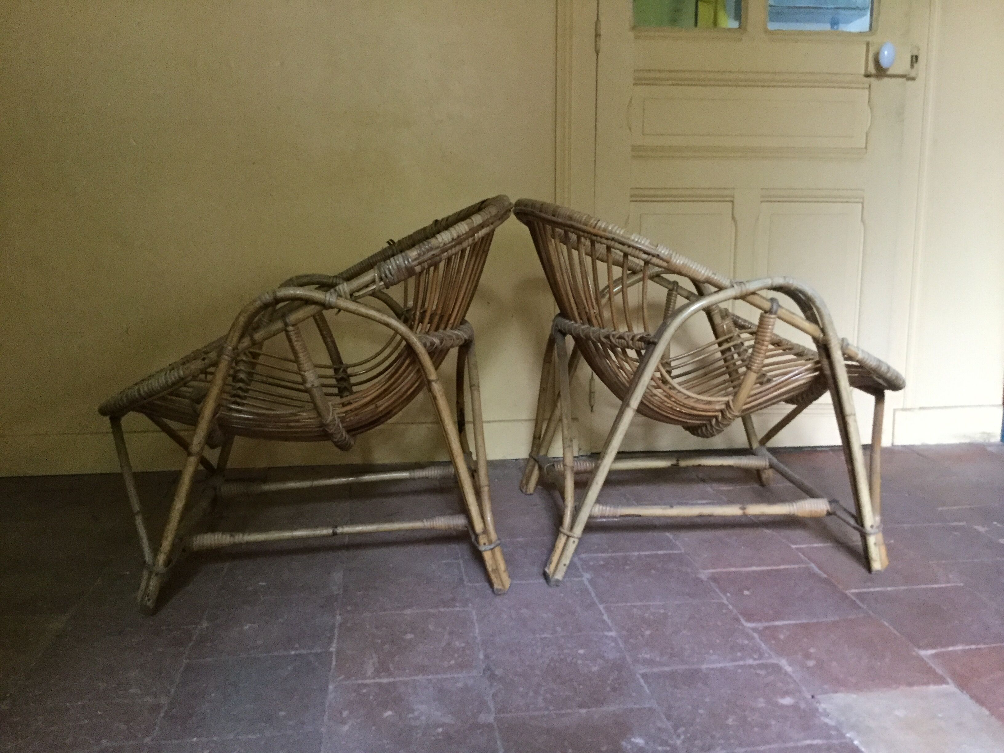 A pair of rattan armchairs