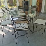 Lot table en verre et 10 chaises en fer forgé