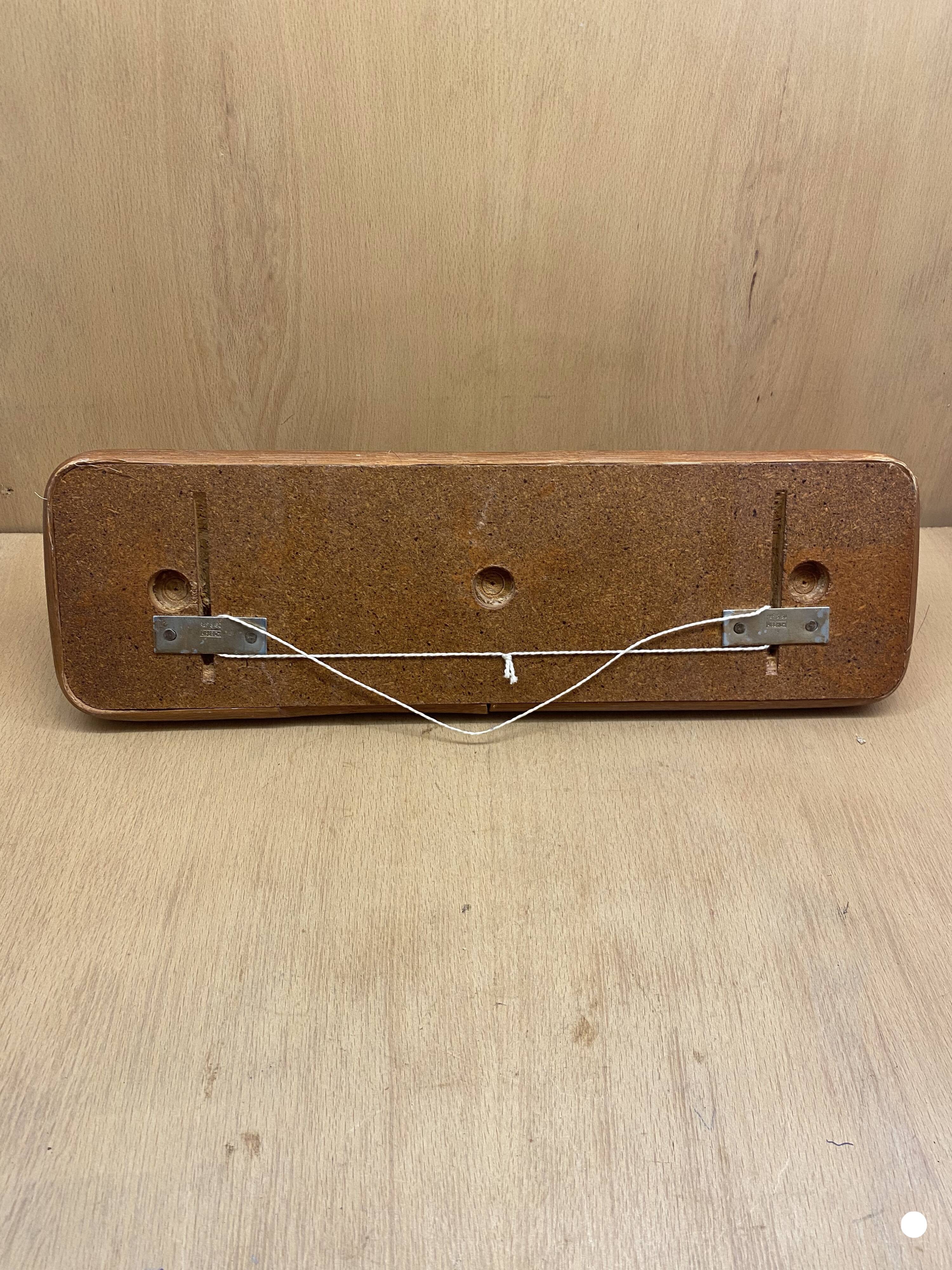 Triple coat rack in brown rattan