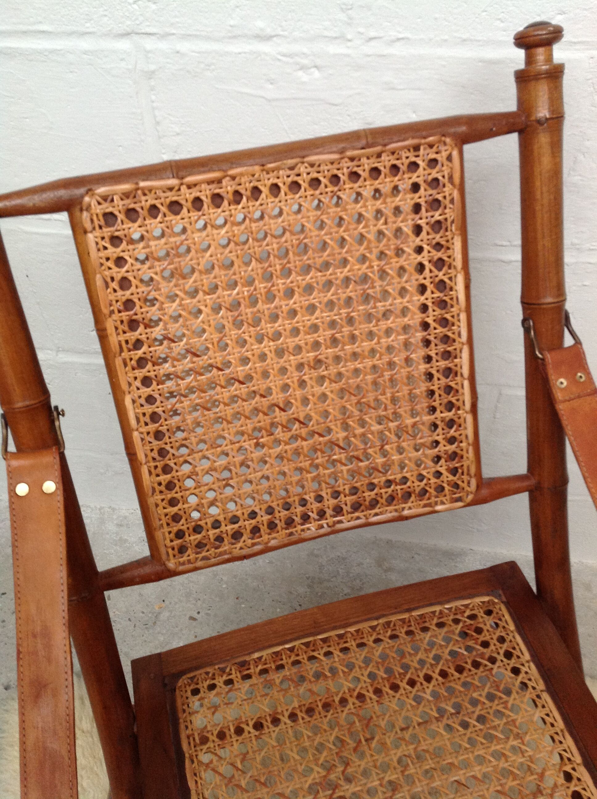 Bamboo folding armchair and caning, leather and brass