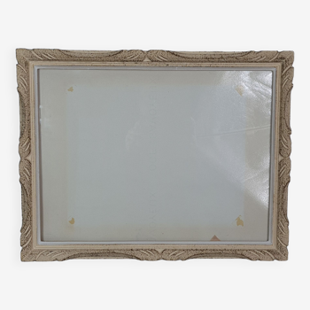 Frame in carved wood patinated