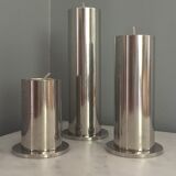 Suite of three brushed steel candlesticks from the 1970s