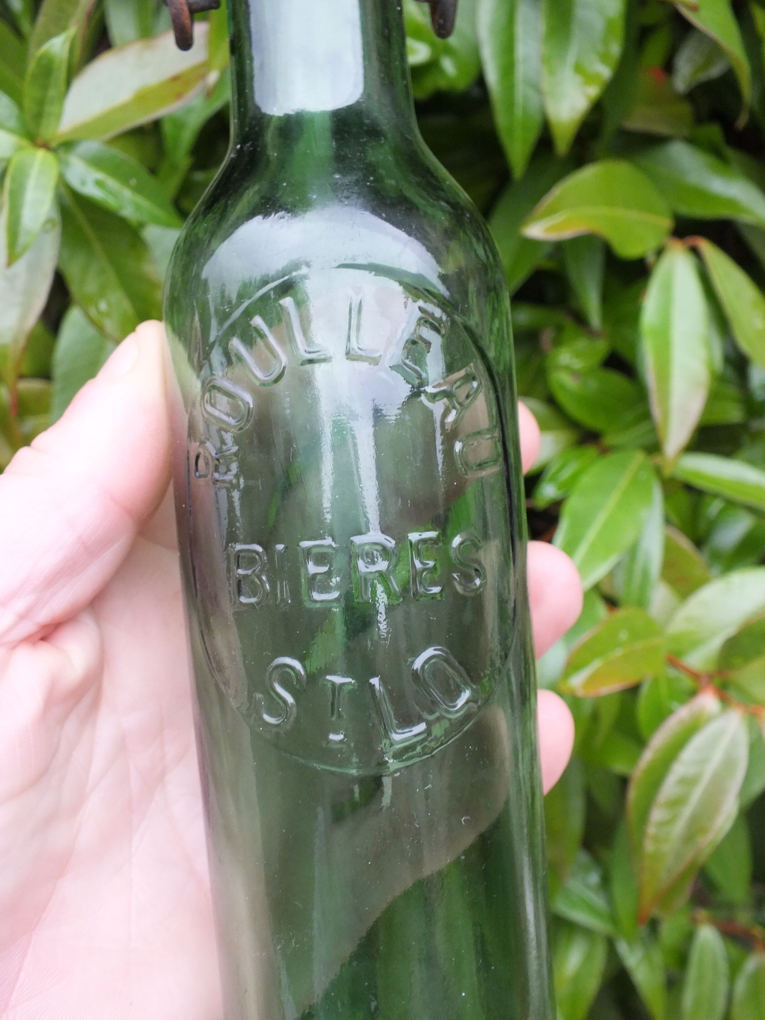 Old bottle of Roulleau beer in Saint Lô (Manche)