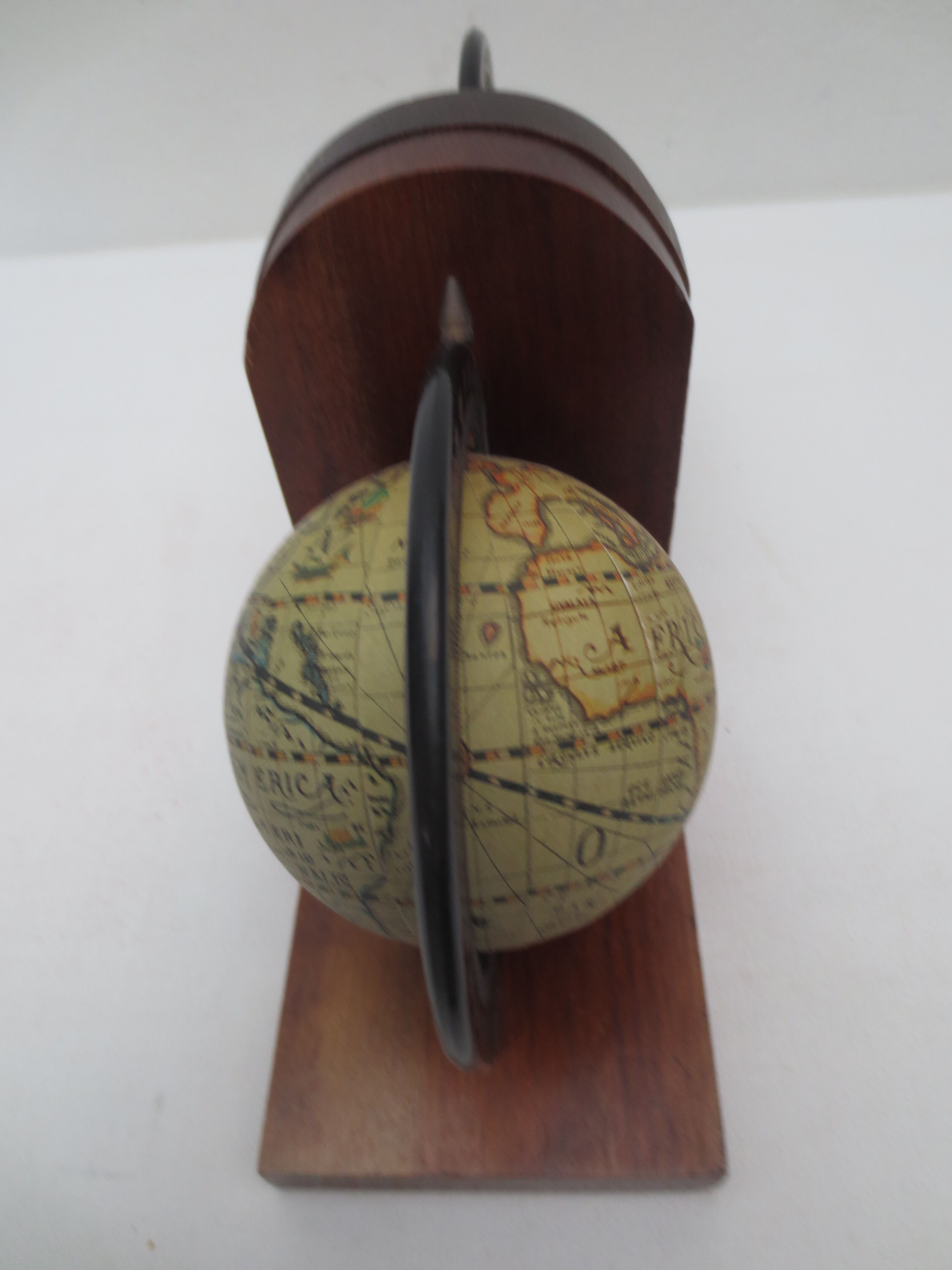 Old pair of greenhouse books in solid wood and world map