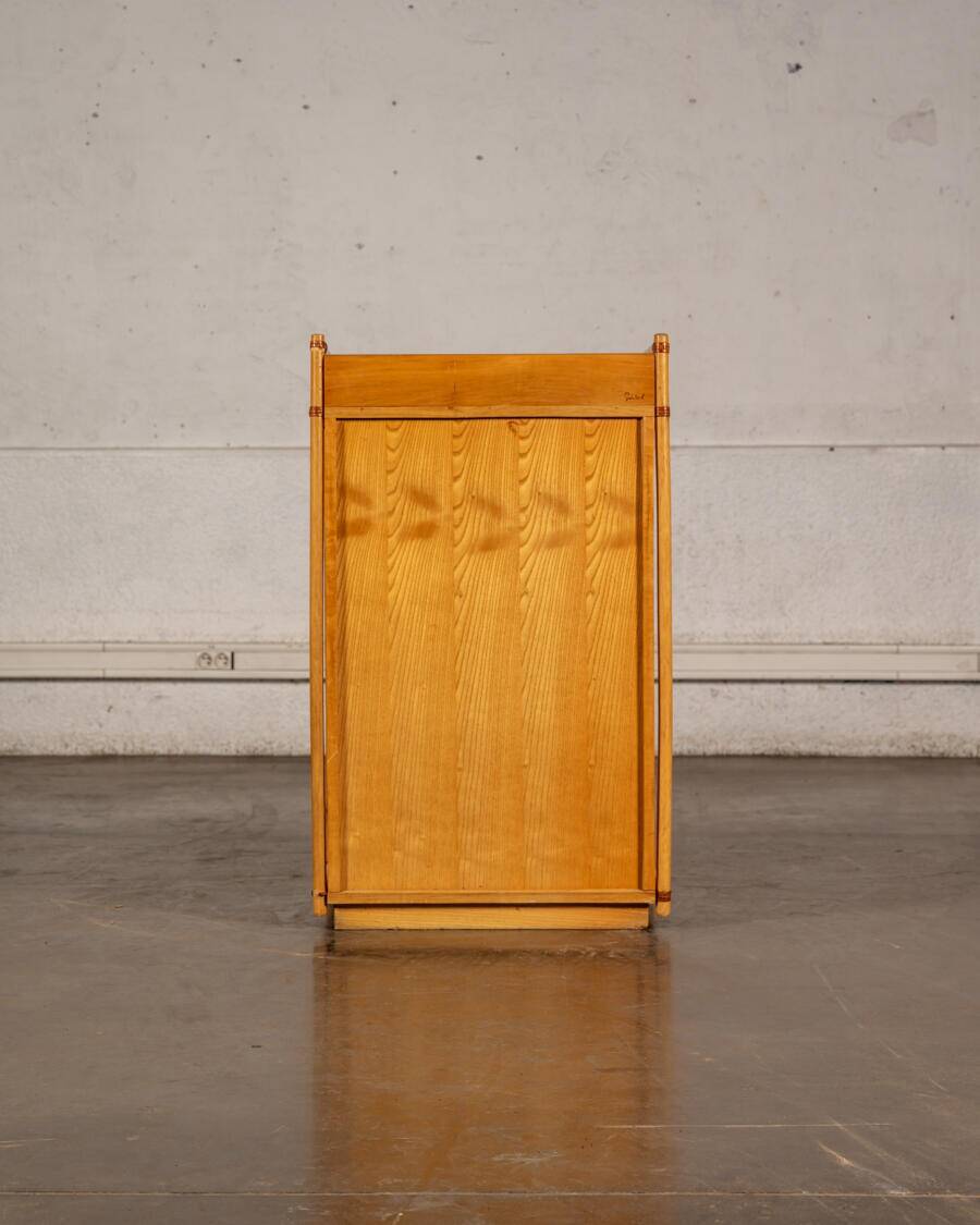 Small storage unit in cane and wood.