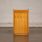 Small storage unit in cane and wood.