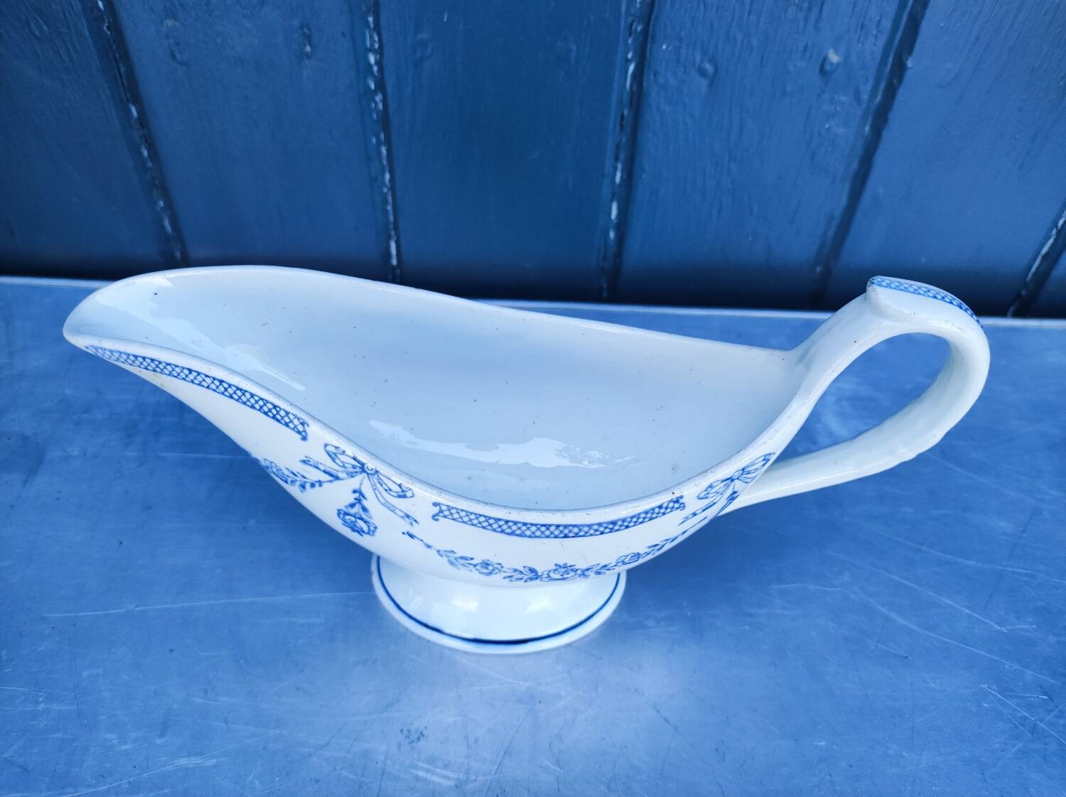 Old earthenware sauce boat