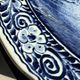 Vintage hollow circular plate in blue and white Boch pottery.