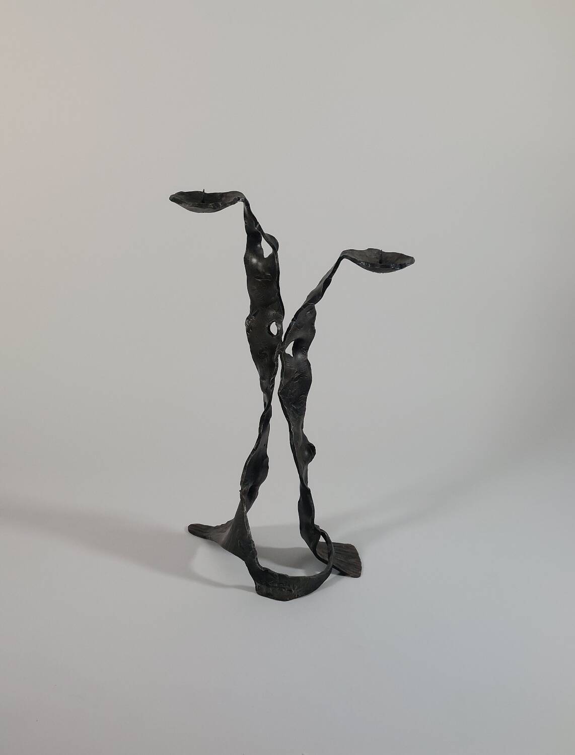 Sculptural brutalist floor candle holder made of hand-forged iron from the 1950s.