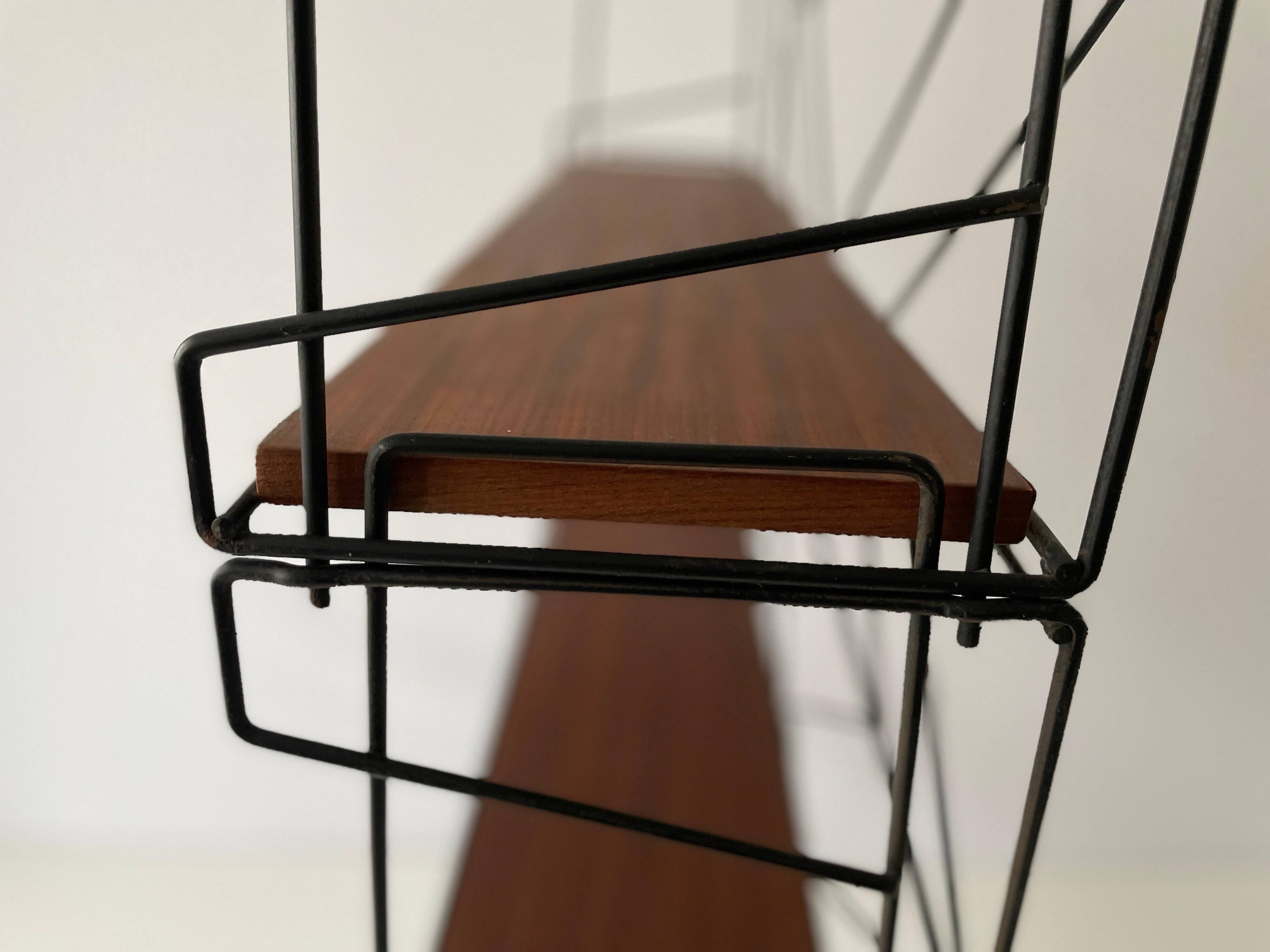 Free-standing shelf with a metal structure and 3 shelves, 1960s, Italy.