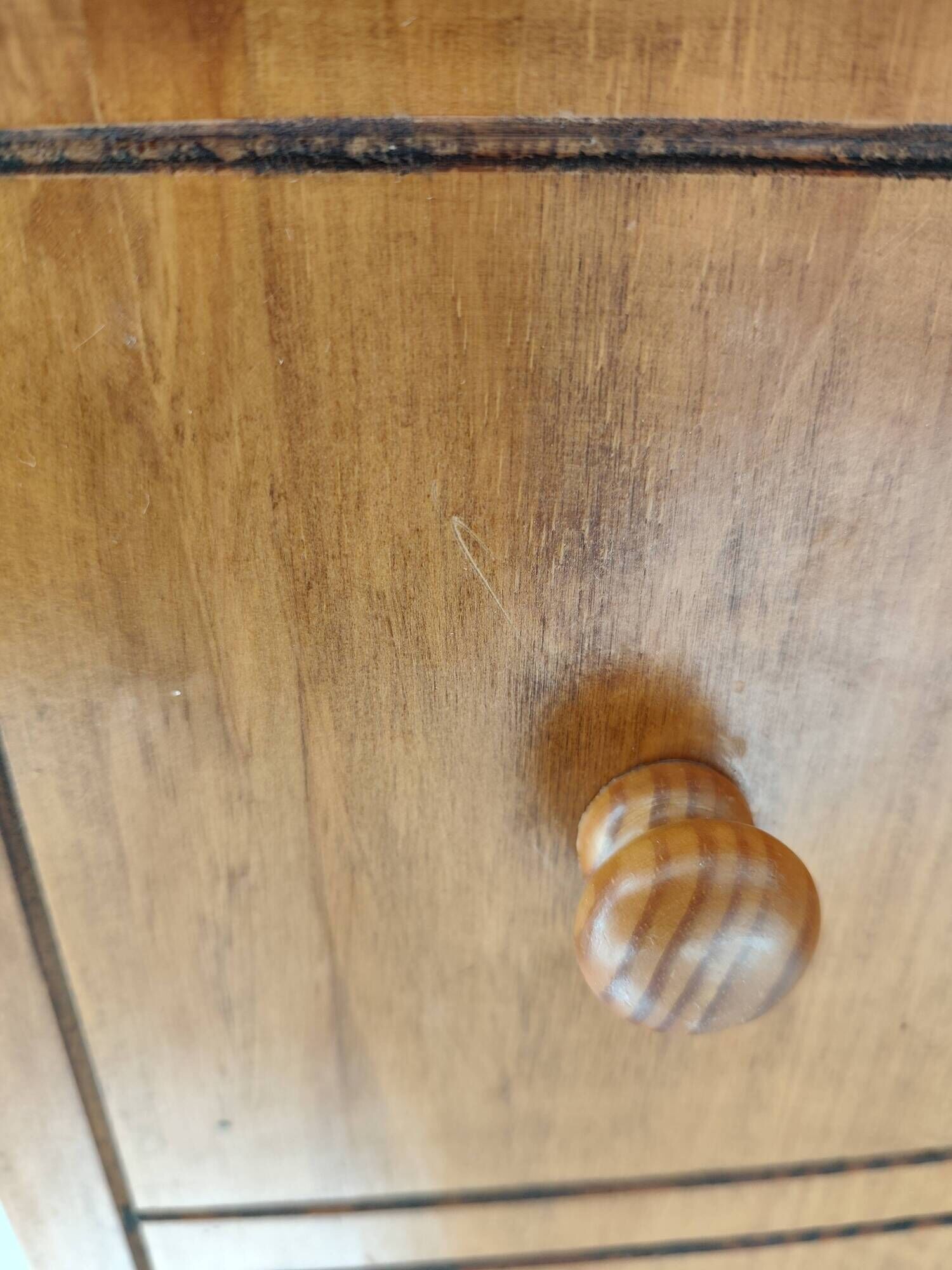 Small wooden piece of furniture, cabinet style, false drawers.