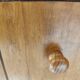 Small wooden piece of furniture, cabinet style, false drawers.