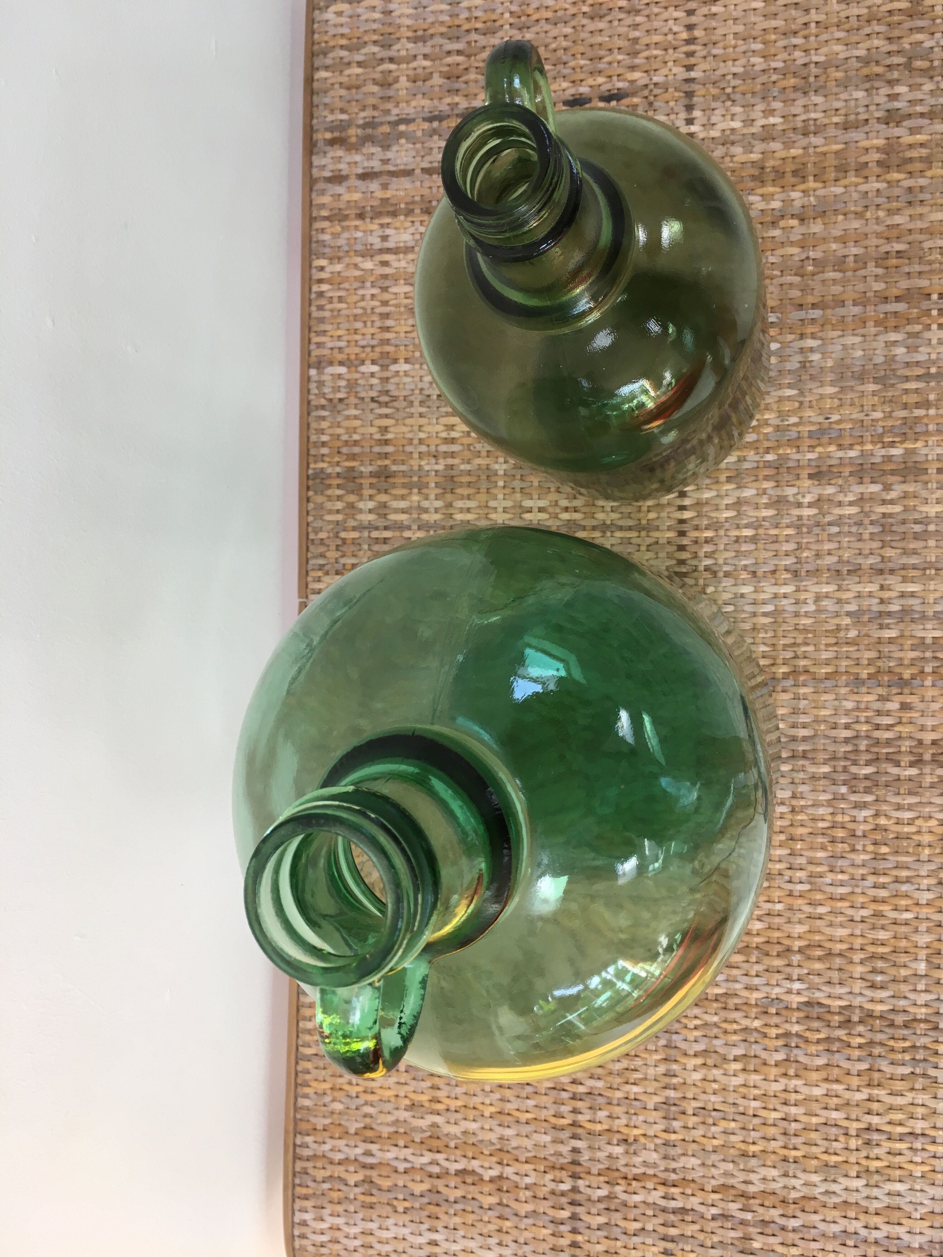 Pair of old demijohn bottles
