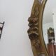 Oval wall mirror, golden floral pattern in stucco and wood, late 19th century