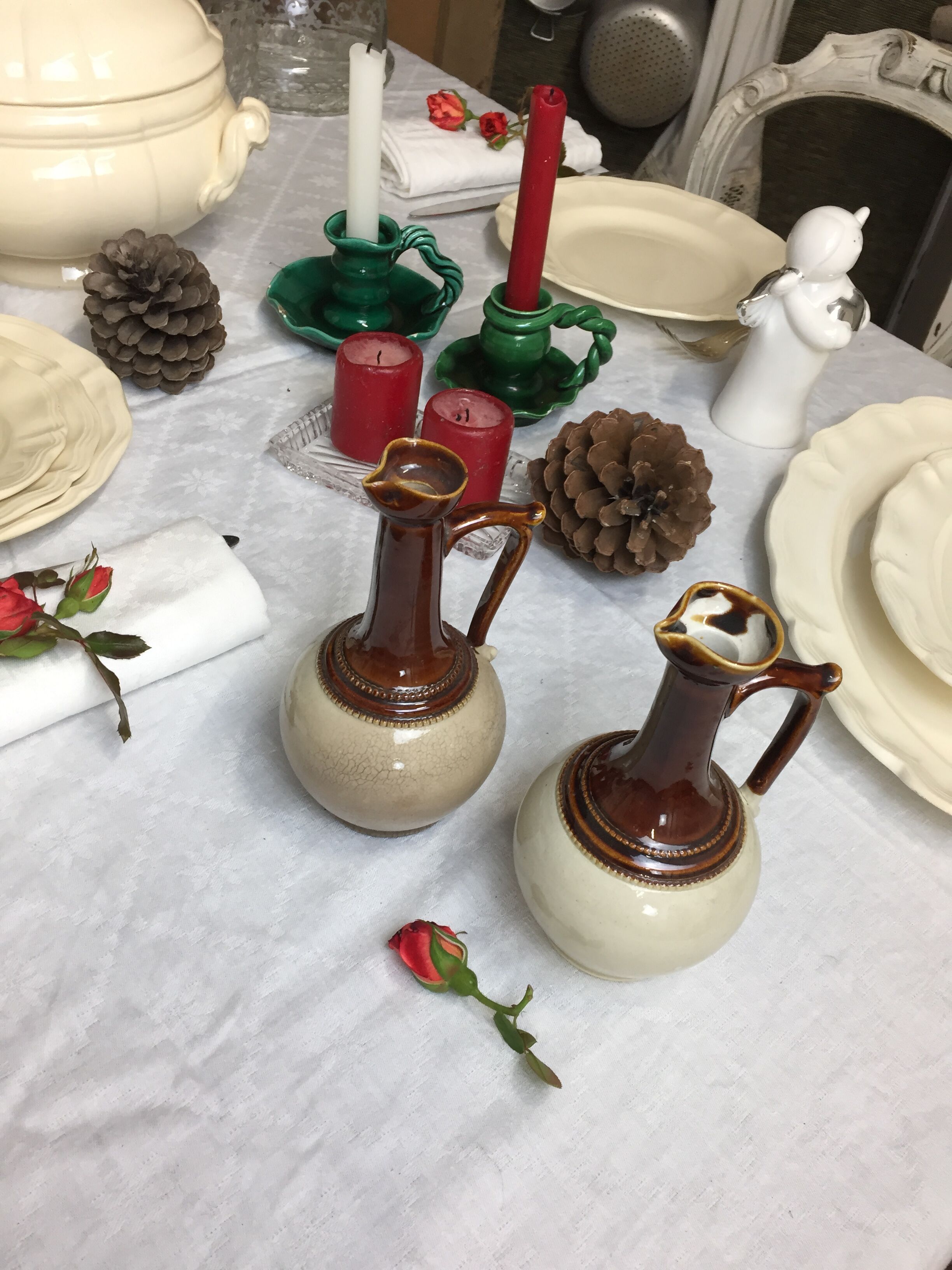 Antique handmade pitchers in beige and brown enamelled terracotta