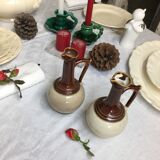 Antique handmade pitchers in beige and brown enamelled terracotta